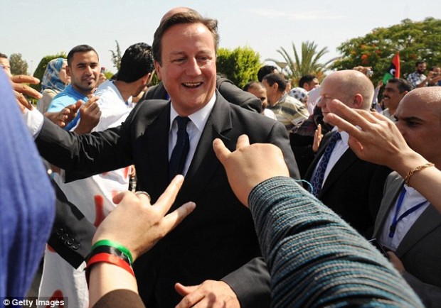 British Prime Minister David Cameron meets patients and staff at the Tripoli Medical Centre as part of their trip in September 2011 