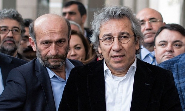 Erdem Gül (left) and Can Dündar speak to the media outside court in Istanbul, Turkey. Photograph: Vedat Arik/AP