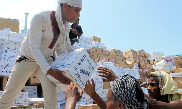 Medical boxes are unloaded from a boat carrying relief aid in Aden last year. Photograph: Saleh Al-Obeidi/AFP/Getty Images