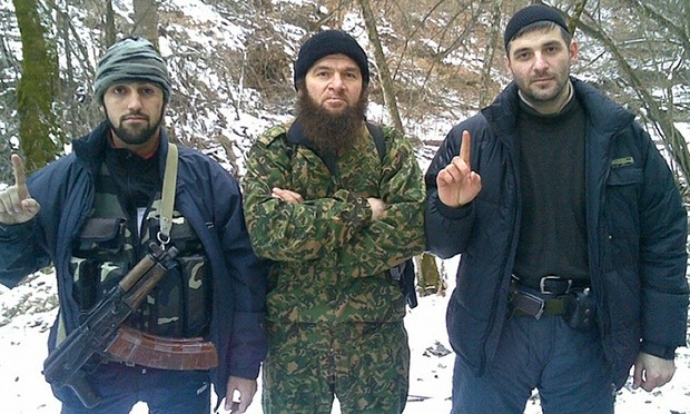Chechen Emirate leader Doku Umarov, centre, poses with two unidentified fighters in an image believed to have been taken in 2010. Photograph: HO/AFP/Getty Images