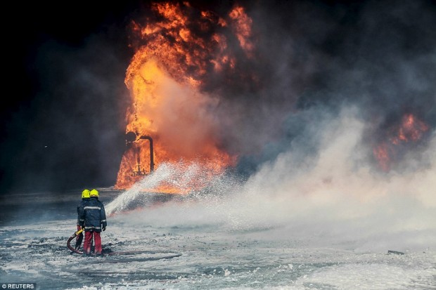 Firefighters tried to put out this fire in Es Sider (pictured) shortly after they were forced to battle two others at the Ras Lanuf terminal