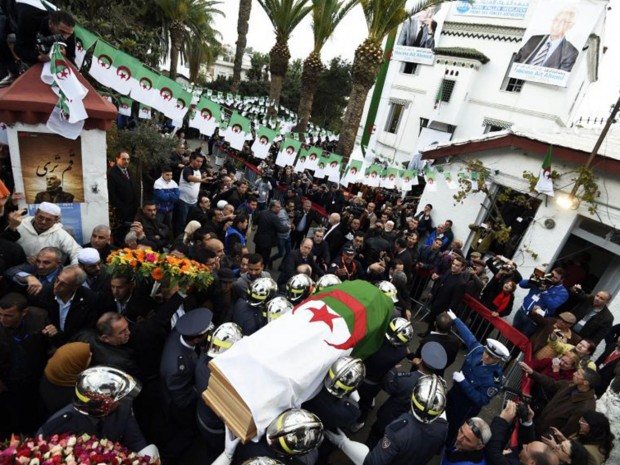 Firemen carry the coffin of opposition leader Hocine Aït Ahmed in Algiers AFP