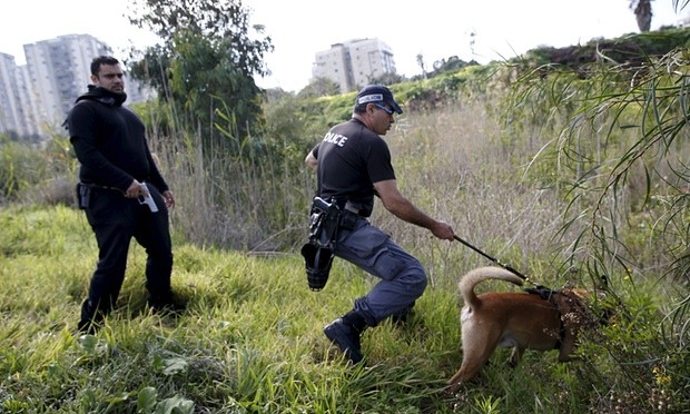 Israeli police searching for the Tel Aviv shooting suspect earlier this week. Photograph: Baz Ratner/Reuters