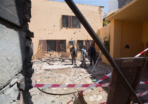 Officials survey the grounds of the the Moroccan Embassy in Libya after a bomb claimed by ISIS exploded / AP