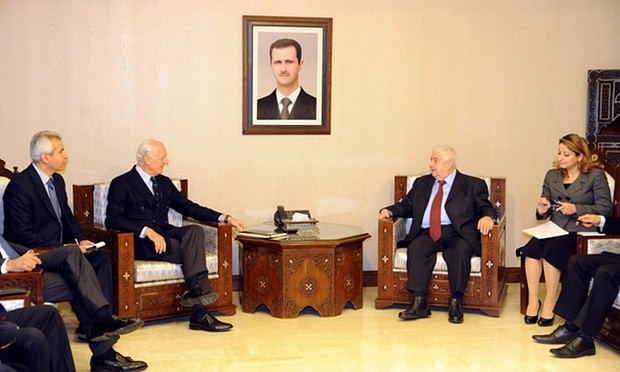 Syria’s foreign minister Walid al-Moallem, second right, meets UN special envoy Staffan de Mistura, second left, in Damascus. Photograph: Uncredited/AP