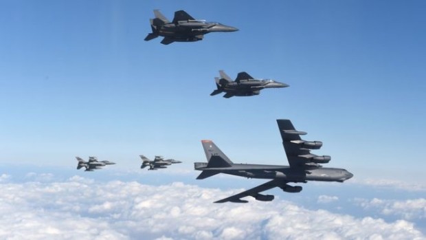 The B-52 - capable of carrying a nuclear bomb - was flanked by US and South Korean fighter jets