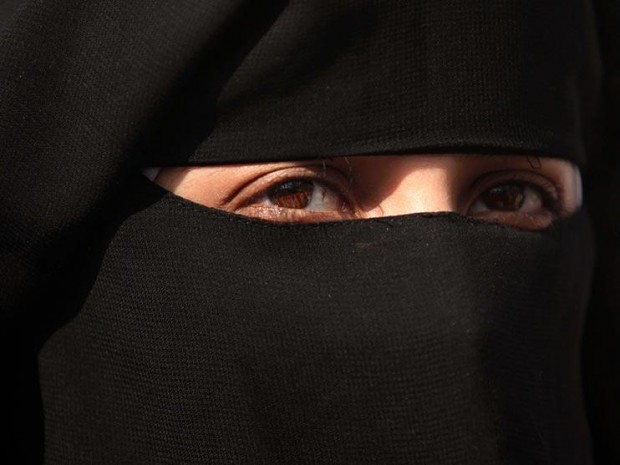 David Cameron has said he will back the right of schools, courts and other British institutions to ban Muslim women from wearing veils Rex Features