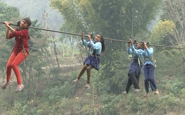 Schoolgirls in a rush to cross Trishuli River on their way to school   Photo: Manish Duwadi / Barcroft India
