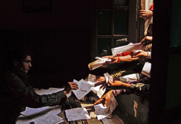 Unemployed Indians handed in paperwork at a government employment office in 2012. Credit Rajesh Kumar Singh/Associated Press