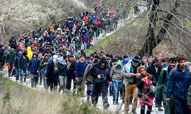  More than a thousand people walk from a camp near the Greek village of Idomeni as they try to find an alternative way to cross the border between Greece and Macedonia. Photograph: Nake Batev/EPA 