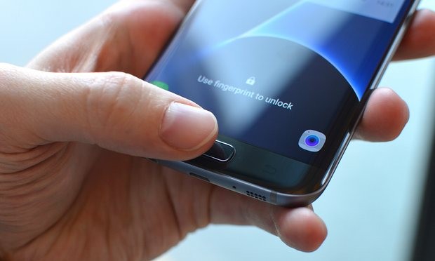 The fingerprint sensor under the home button works very well, but not when your finger or the phone is wet. Photograph: Samuel Gibbs for the Guardian
