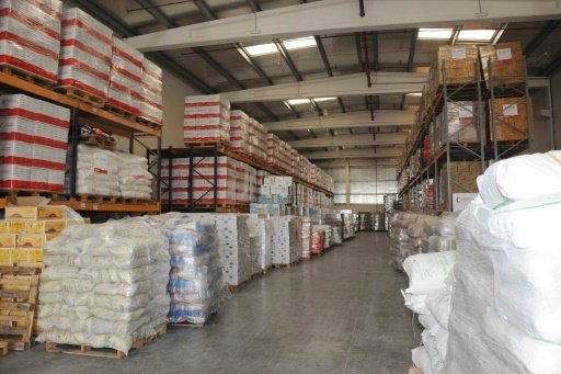 © WAM/AFP | Boxes of humanitarian aid stacked at a warehouse near the United Arab Emirates Red Crescent headquarters in Abu Dhabi on March 30, 2016, before it is transported to war-torn Libyan city Benghazi