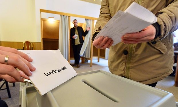  Germans cast their ballots in Stößen, Saxony-Anhalt. Photograph: Martin Schutt/EPA 