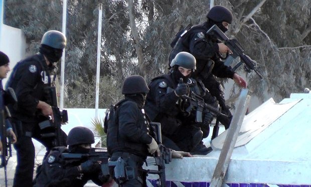  Tunisian special forces take position during clashes with militants in Ben Guerdane. Photograph: Fathi Nasri/AFP/Getty Images 