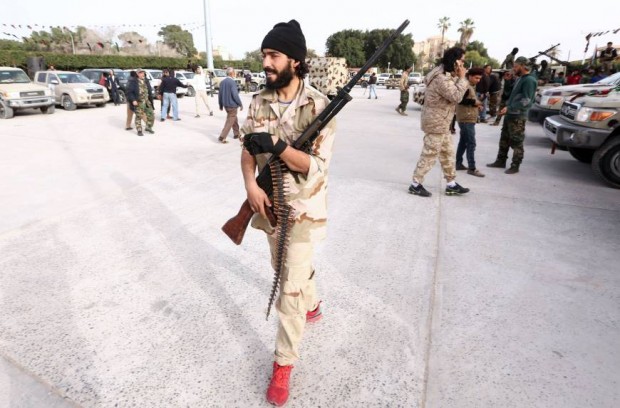 A Member of a brigade loyal to the Fajr Libya (Libya Dawn), an alliance of Islamist-backed fighters, takes part in a military parade following battles against the Islamic State (IS) group, in the city of Sabratha, west of the capital Tripoli, on February 28. | AFP-JIJI