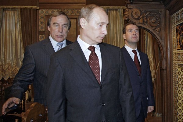 From left, the cellist Sergei P. Roldugin, Vladimir V. Putin and Dmitry Medvedev at the House of Music in St. Petersburg in 2009. 