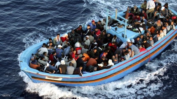 A boat loaded with illegal immigrant. (Photo by Marco Di Lauro/Getty Images)