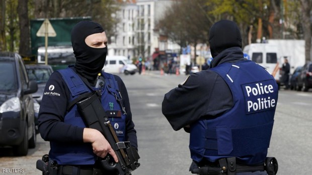 Belgium police officers secure the access during a police operation in Etterbeeck, near Brussels, Belgium, April 9, 2016. REUTERS/Yves Herman