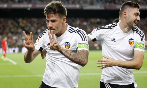 Valencia’s Santi Mina celebrates scoring his side’s second goal against Barcelona. Photograph: Bagu Blanco/BPI/REX/Shutterstock