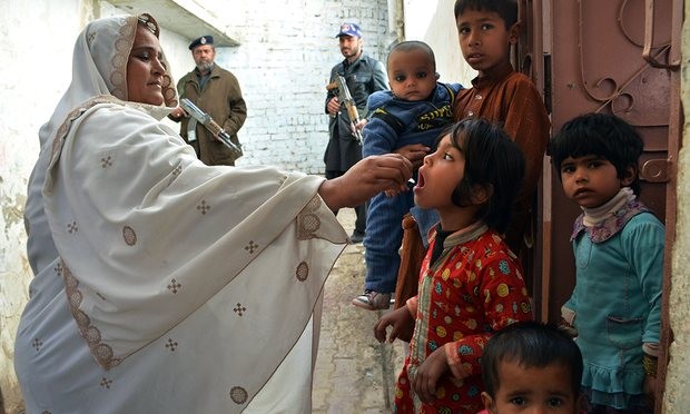 A Pakistani health worker administers polio drops to a child during a vaccination campaign in Quetta. Photograph: Banaras Khan/AFP/Getty Images