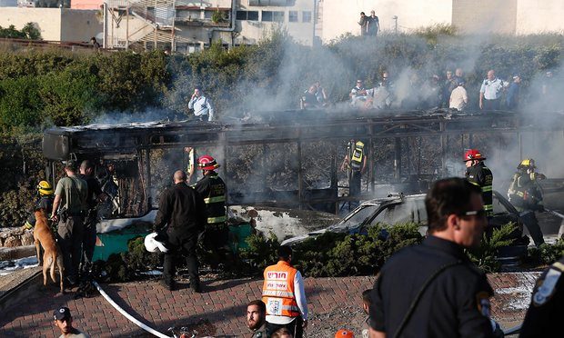 The burned-out bus following an attack in Jerusalem Photograph: Thomas Coex/AFP/Getty Images