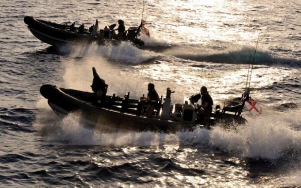  Royal Marines in the 150-strong task group have been practising boarding and searching small craft Credit: MoD 