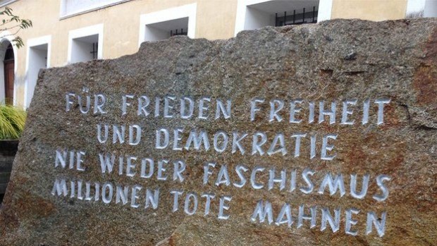 A stone plaque outside Hitler's birthplace honours the victims of fascism