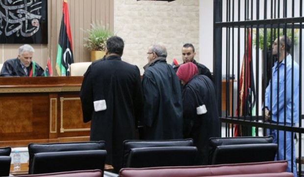 In 2011, Mr Peters helped Colonel Muammar Gaddafi's son Saadi (far right in blue) defy a United Nations travel ban and flee his besieged compound for Niger