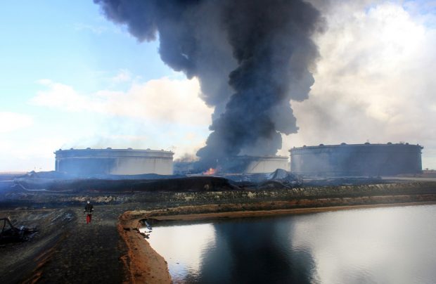 Smoke rising from an oil facility in northern Libya's Ras Lanouf region in January after it was set ablaze following fresh attacks by the Islamic State gto seize key port terminals. (STRINGER/AFP/Getty Images)