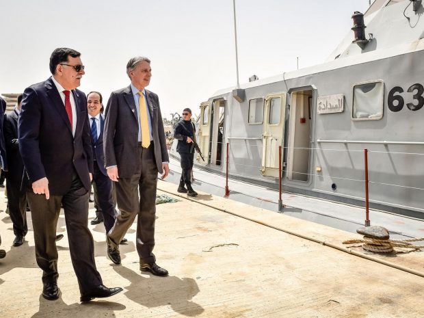 Foreign Secretary Philip Hammond, with Libya's Prime Minister-designate Fayez Sarraj, toured a naval base during his visit to Tripoli PA