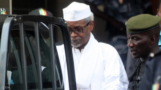 Former Chadian dictator Hissene Habre is escorted by military officers  after being heard by judge on July 2, 2013 in Dakar. Senegalese authorities charged Hissene Habre with genocide and crimes against humanity and remanded him in custody on Tuesday in a prosecution seen by many as a milestone for African justice. The 70-year-old was also charged with war crimes and torture during his eight years in power in Chad, where rights groups say 40,000 people were killed under his rule, a court source and his lawyers told AFP.   AFP PHOTO / STRINGER