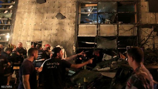 Civil defense members and policemen inspect the site of an explosion at Blom Bank in Beirut, Lebanon June 12, 2016. REUTERS/Jamal Saidi