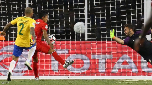 FOXBORO, MA - JUNE 12:  Raul Ruidiaz #11 of Peru scores on Alisson Becker #1 of Brazil in the second half during the 2016 Copa America Centenario Group B match against Brazil  at Gillette Stadium on June 12, 2016 in Foxboro, Massachusetts. (Photo by Jim Rogash/Getty Images)