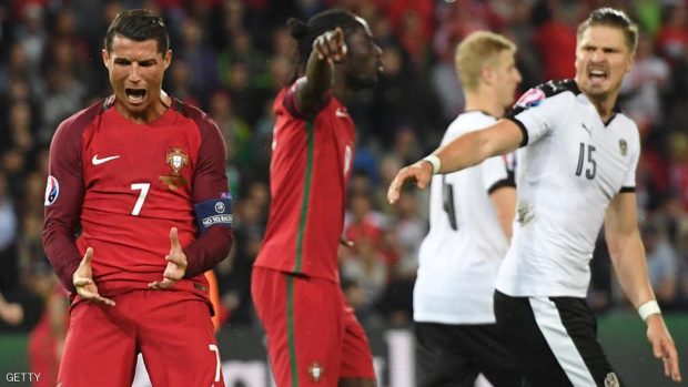 Portugal's forward Cristiano Ronaldo (L) reacts after missing an opportunity on goal during the Euro 2016 group F football match between Portugal and Austria at the Parc des Princes in Paris on June 18, 2016. FRANCISCO LEONG/AFP/Getty Images