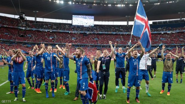 Iceland's players celebrate after the Euro 2016 group F football match between Iceland and Austria at the Stade de France stadium in Saint-Denis, near Paris on June 22, 2016. / AFP / KENZO TRIBOUILLARD        (Photo credit should read KENZO TRIBOUILLARD/AFP/Getty Images)