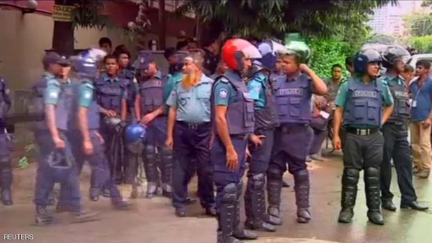 Police gather after gunmen attacked the Holey Artisan restaurant and took hostages early on Saturday, in Dhaka, Bangladesh in this still frame taken from live video July 2, 2016. REUTERS/REUTERS TV