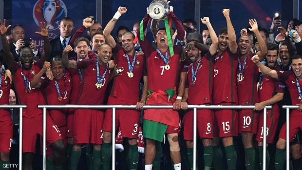 PARIS, FRANCE - JULY 10:  Cristiano Ronaldo of Portugal (c) lifts the European Championship trophy after his side win 1-0 against France during the UEFA EURO 2016 Final match between Portugal and France at Stade de France on July 10, 2016 in Paris, France.  (Photo by Michael Regan/Getty Images)