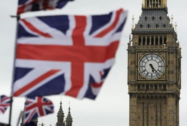 Flags are seen above a souvenir kiosk near Big Ben clock at the Houses of Parliament in central London June 26, 2012.  REUTERS/Paul Hackett