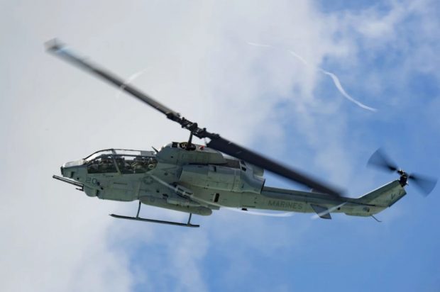 A U.S. Marine Corps AH-1W Super Cobra with Marine Light Attack Helicopter Squadron (HMLA) 367, Marine Aircraft Group 24, supports a beach assault during Rim of the Pacific 2016. (Mass Communication Specialist 2nd Class Katarzyna Kobiljak/U.S. Navy)