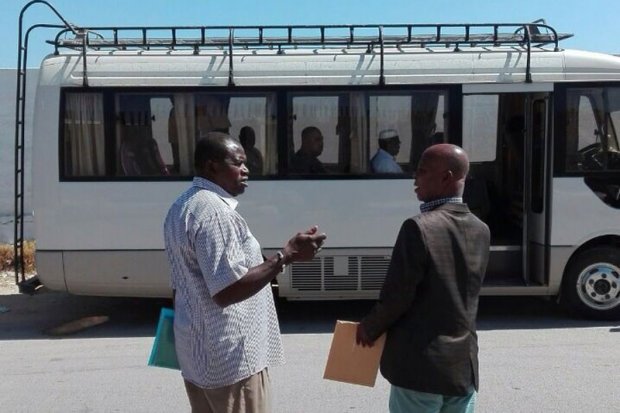 An IOM bus takes embassy representatives to the detention center. Photo: IOM