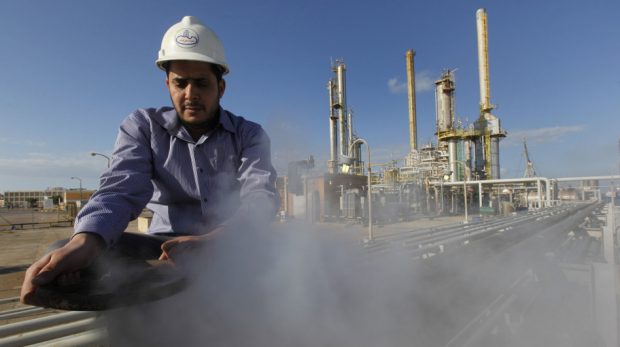 A Libyan oil worker at a refinery inside the Brega oil complex, in eastern Libya, on Feb. 26. Production at Brega has dropped by almost 90 percent amid the country's crisis because many employees have fled, and few ships are coming to the port.