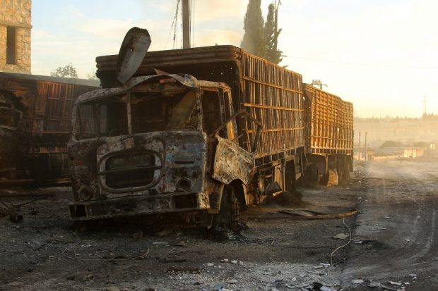 Damaged aid trucks are pictured after an airstrike on the rebel held Urm al-Kubra town, western Aleppo city, Syria September 20, 2016. REUTERS/Ammar Abdullah