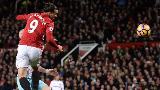 Manchester United's Swedish striker Zlatan Ibrahimovic leaps to head the ball and score their first goal to equalise 1-1 during the English Premier League football match between Manchester United and West Ham United at Old Trafford in Manchester, north west England, on November 27, 2016. OLI SCARFF/AFP/Getty Images