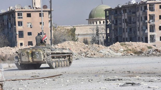 A Syrian government soldier rides a military vehicle near a mosque, after taking control of Aleppo's Al-Haidariya neighbourhood, Syria in this handout picture provided by SANA on November 28, 2016. SANA/Handout via REUTERS